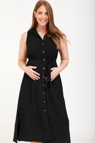 אישה לובשת שמלת הריון מארון שמנת כתום