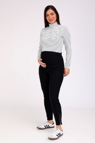 אישה לובשת מכנסי הריון אן שחורים של אבישג ארבל